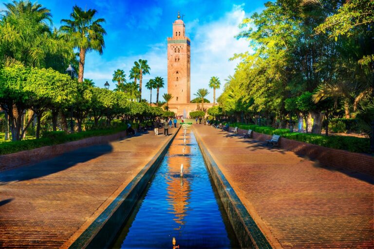 The Koutoubia minaret reflected in a garden water channel in Marrakech